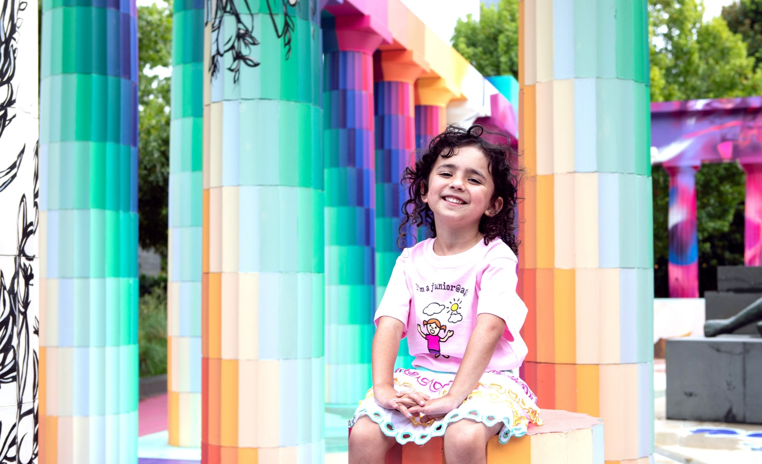 girl in pink shirt sitting in NGV