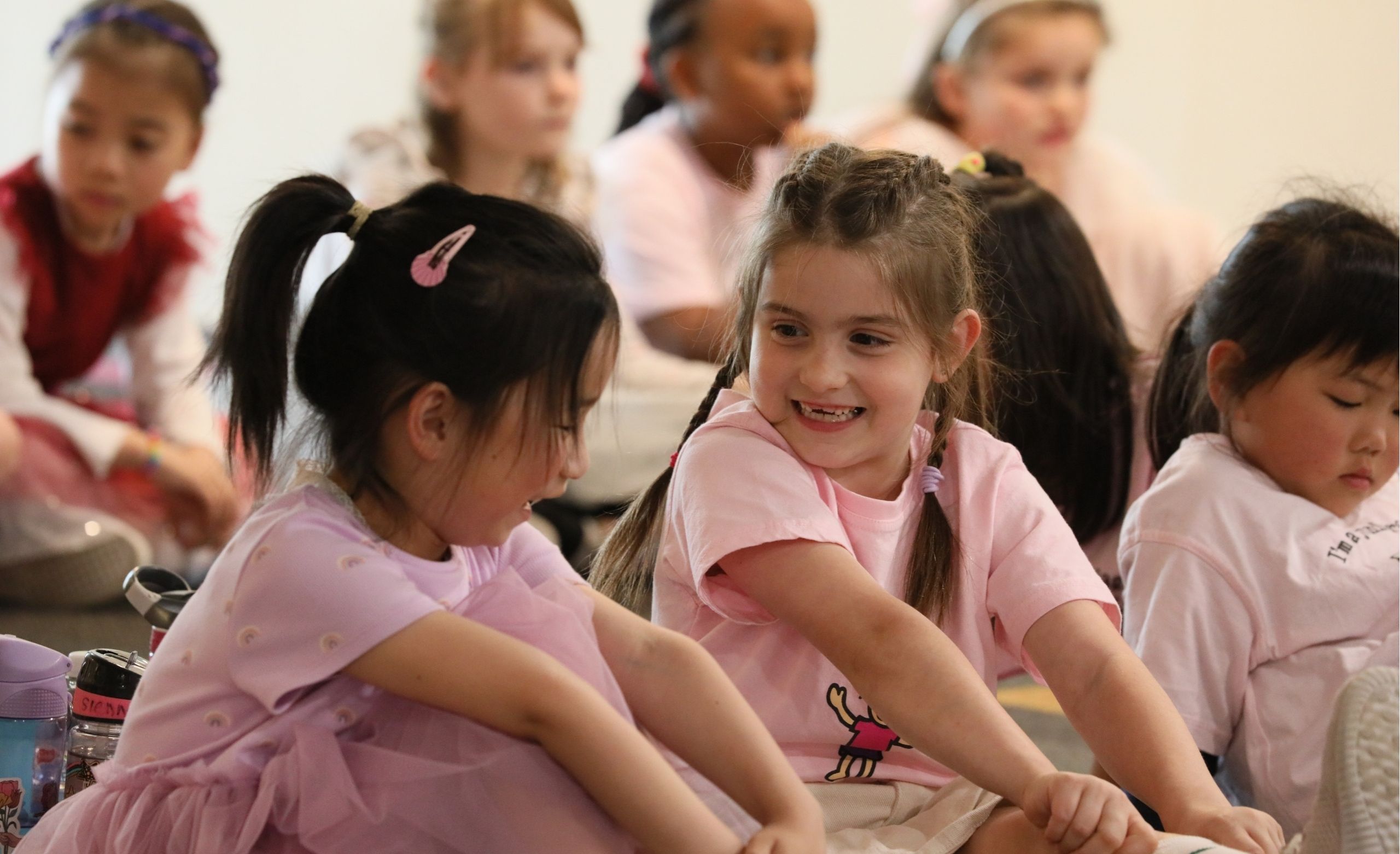 Two young choristers interacting in class