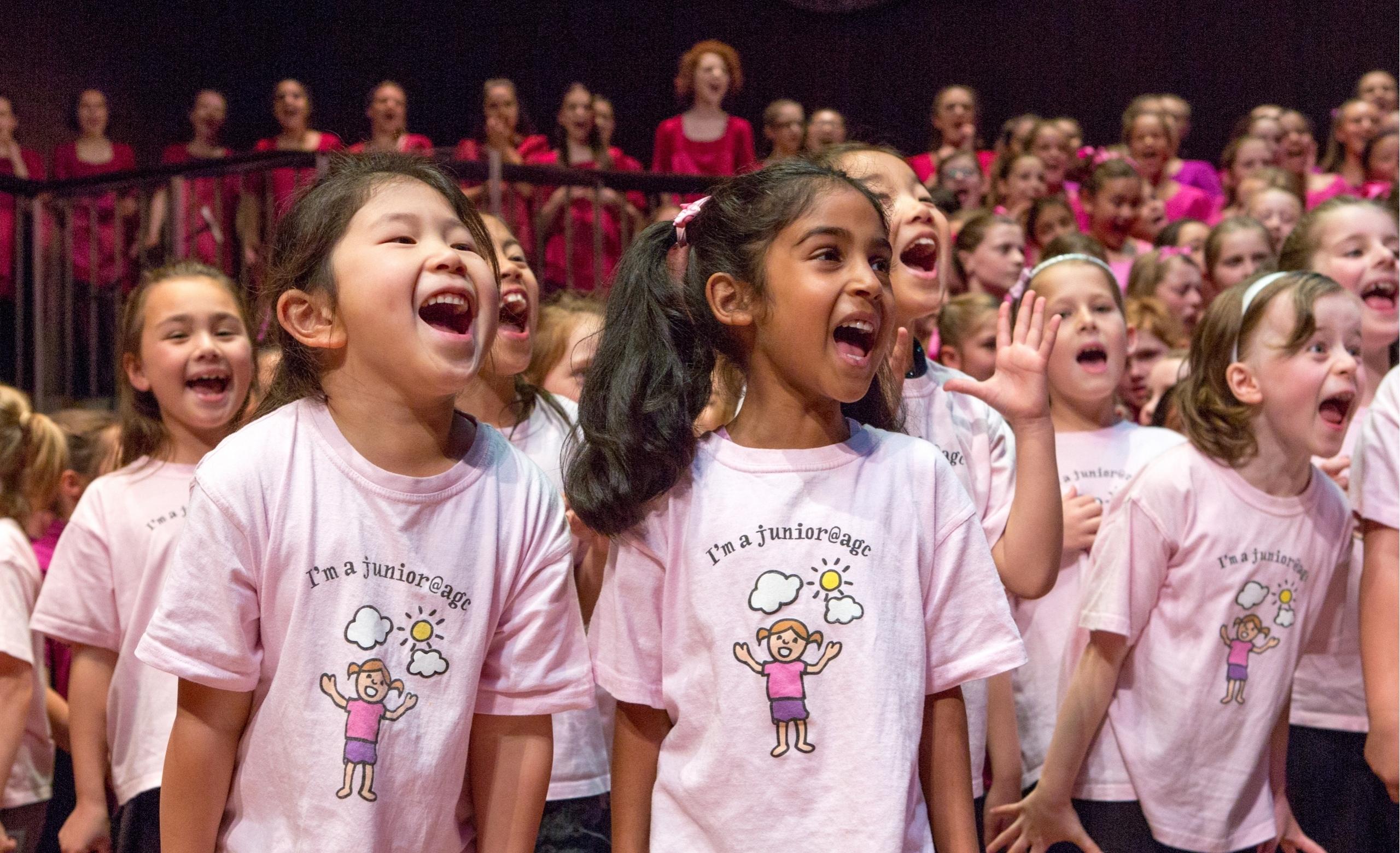 Junior choir girls performing on stage