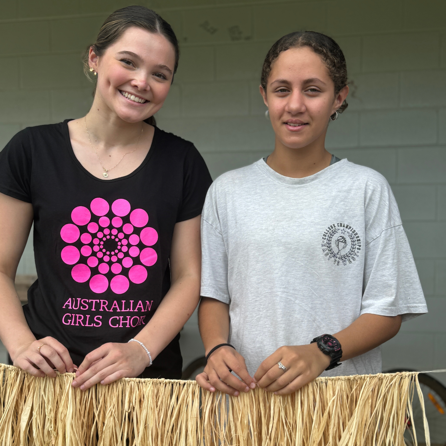 Girls make a jaji (grass skirt) together