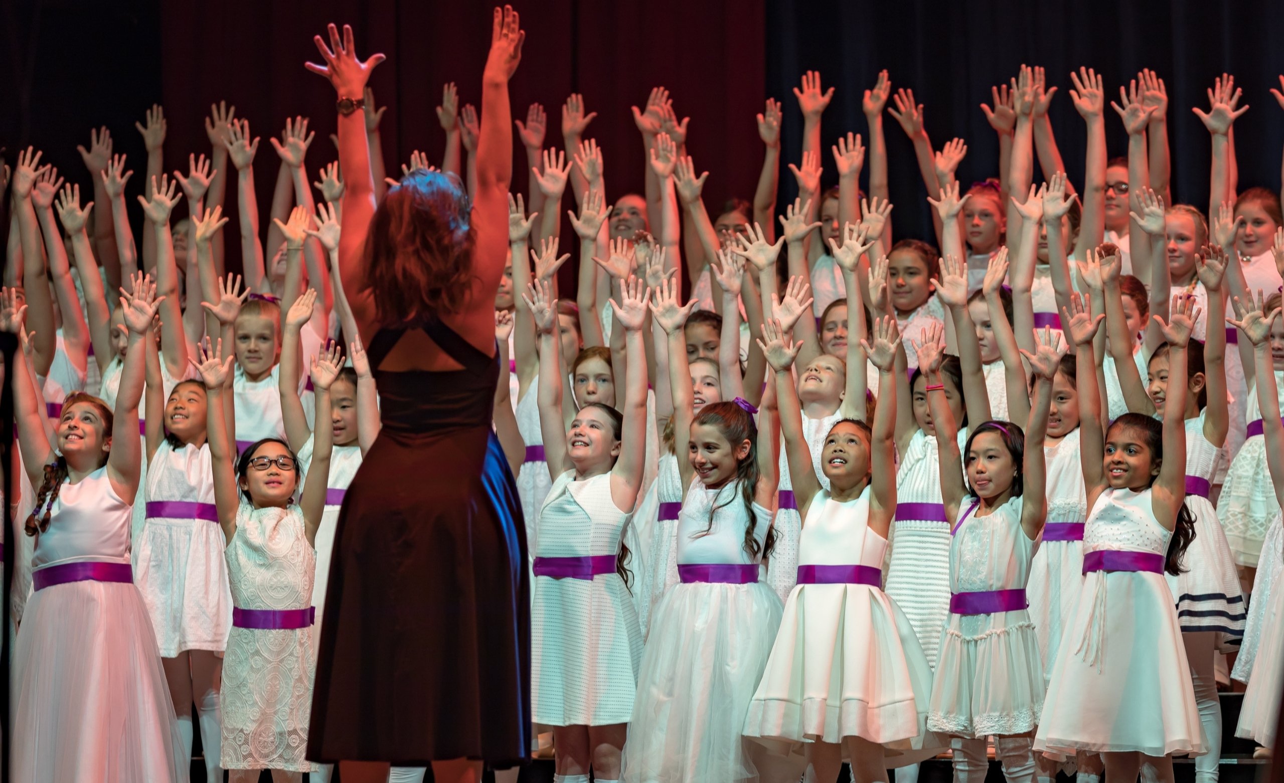 AGC tutor Anna Joyce conducts junior@ choristers during an Annual Concert