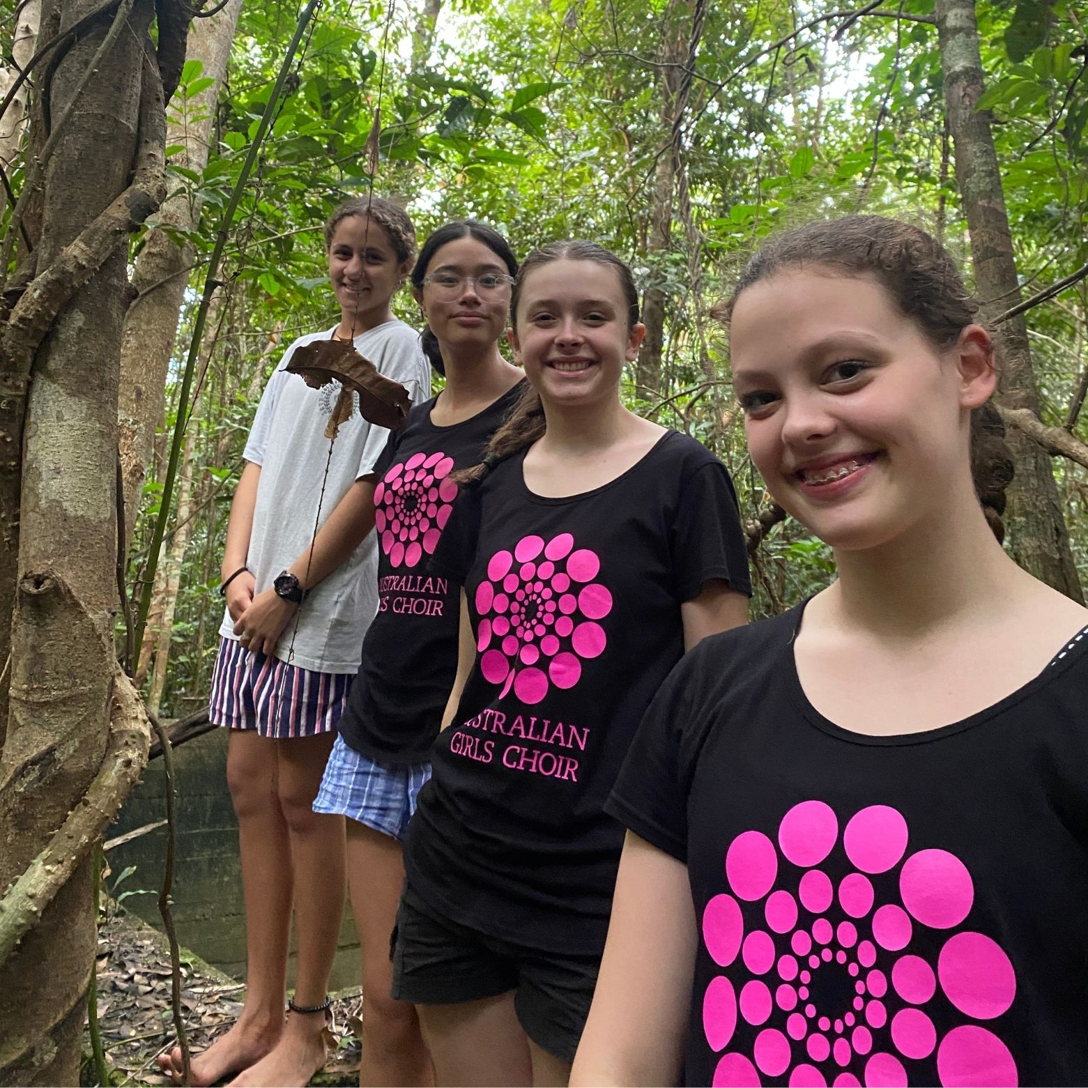 AGC choristers and friend in the rainforest