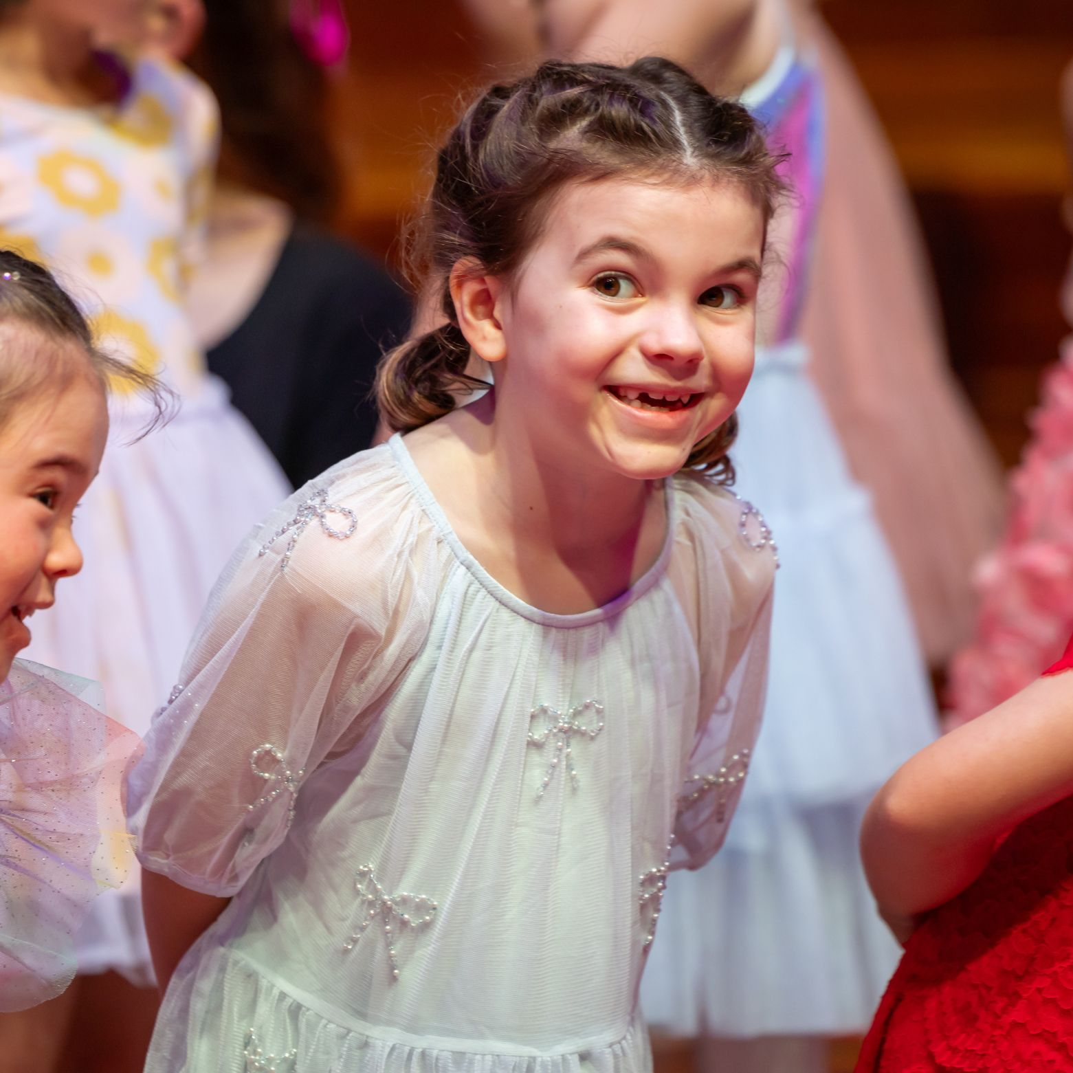 junior@agc chorister pulls a cheeky face on stage