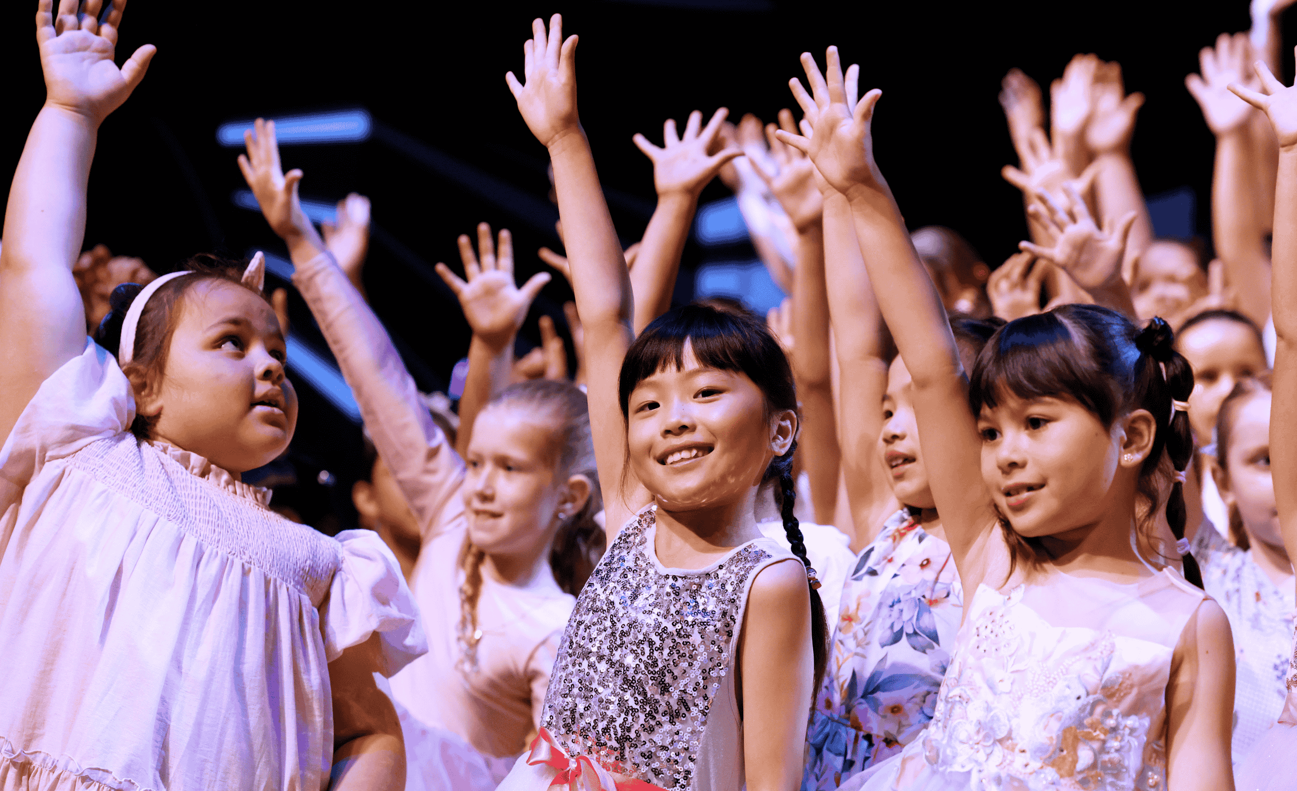 girls in dresses performing
