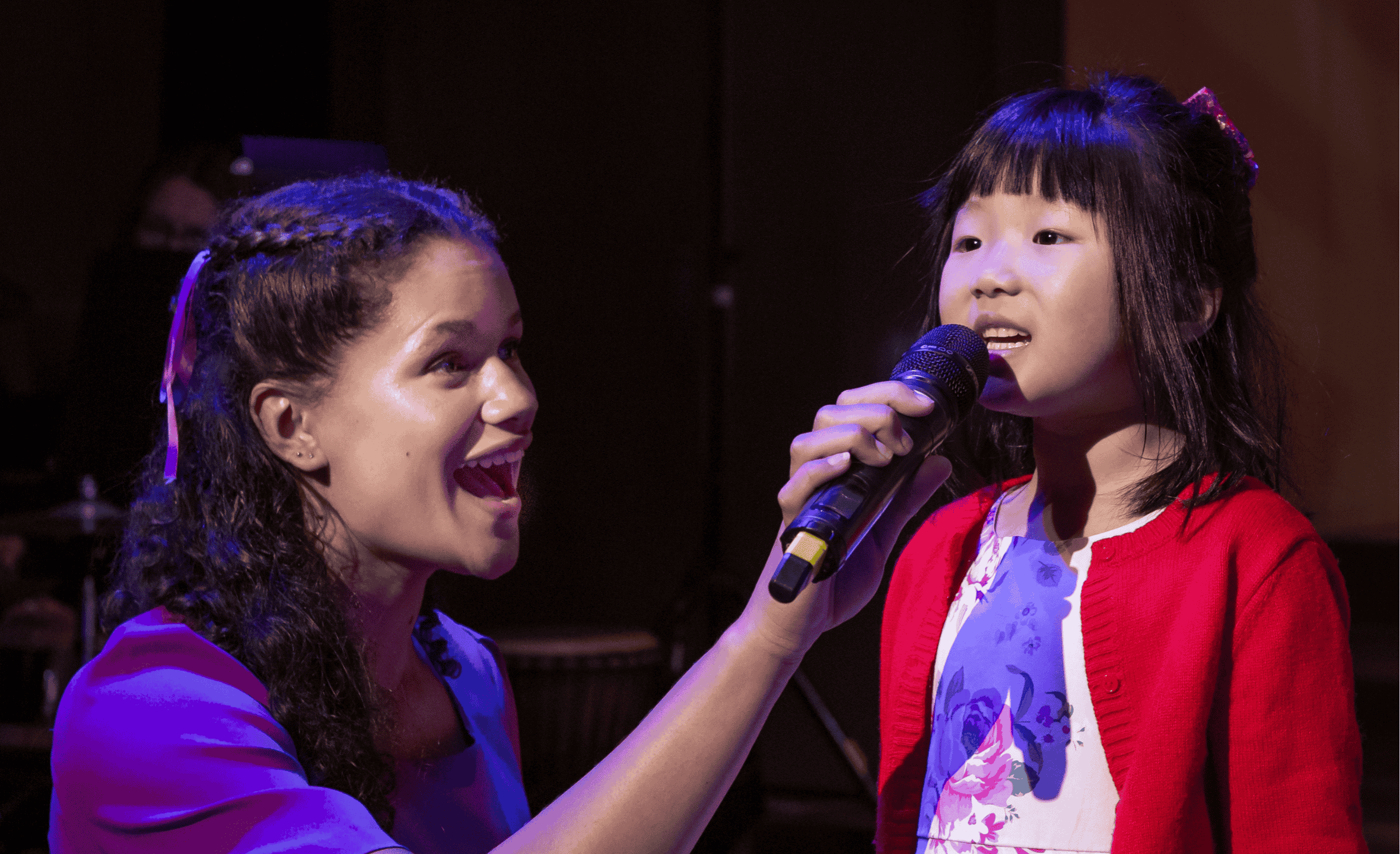Girls singing with mic