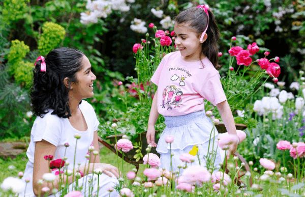 girls in pink shirts in garden
