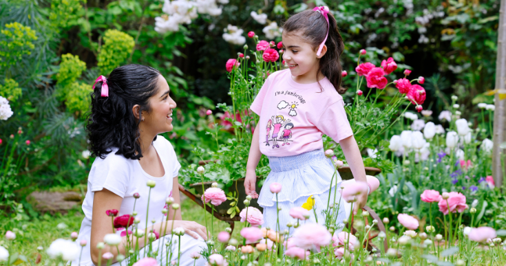 girls in pink shirts in garden